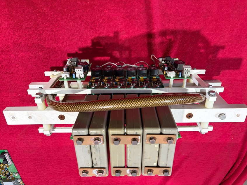 Complete inverter power assembly with capacitor modules, control boards and busbars.