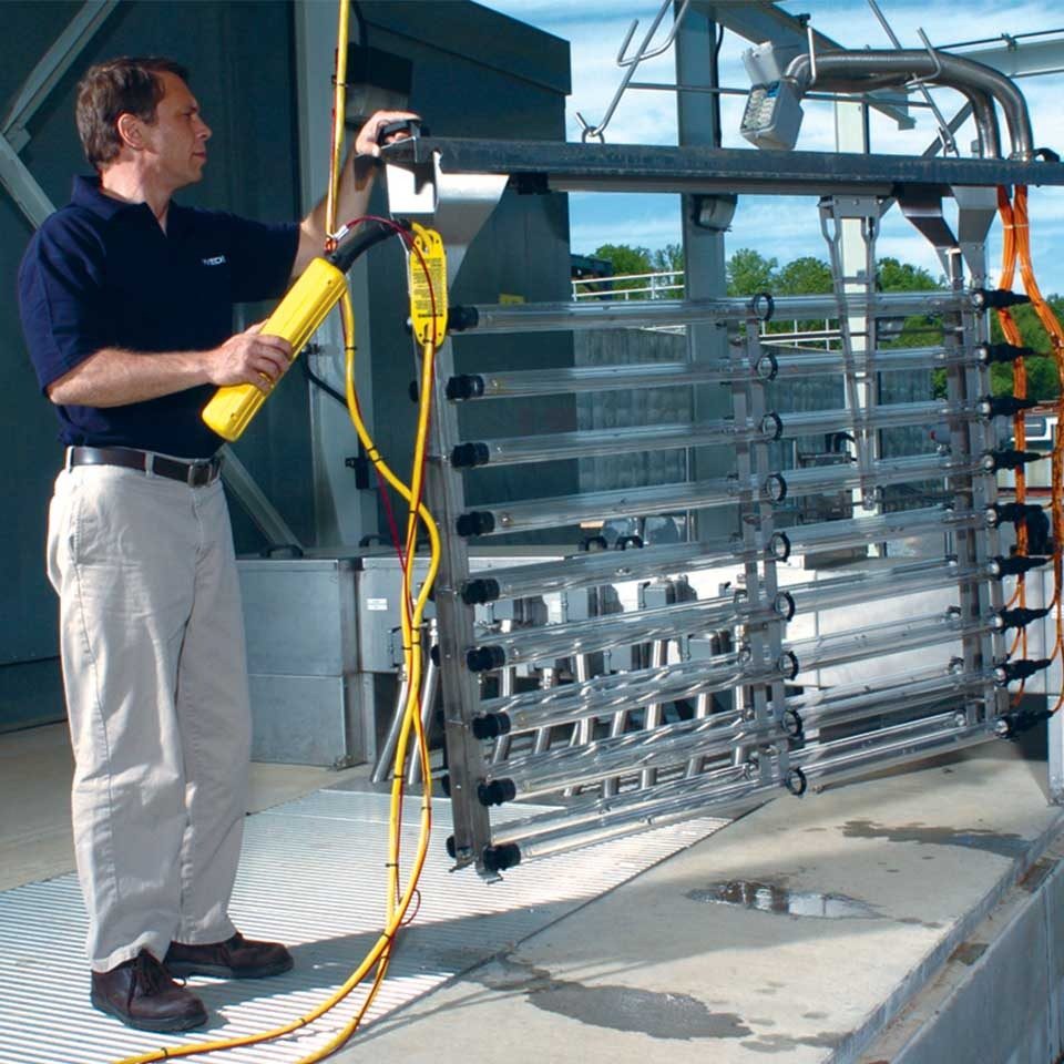 WEDECO Operator lifting a TAK 55 UV module